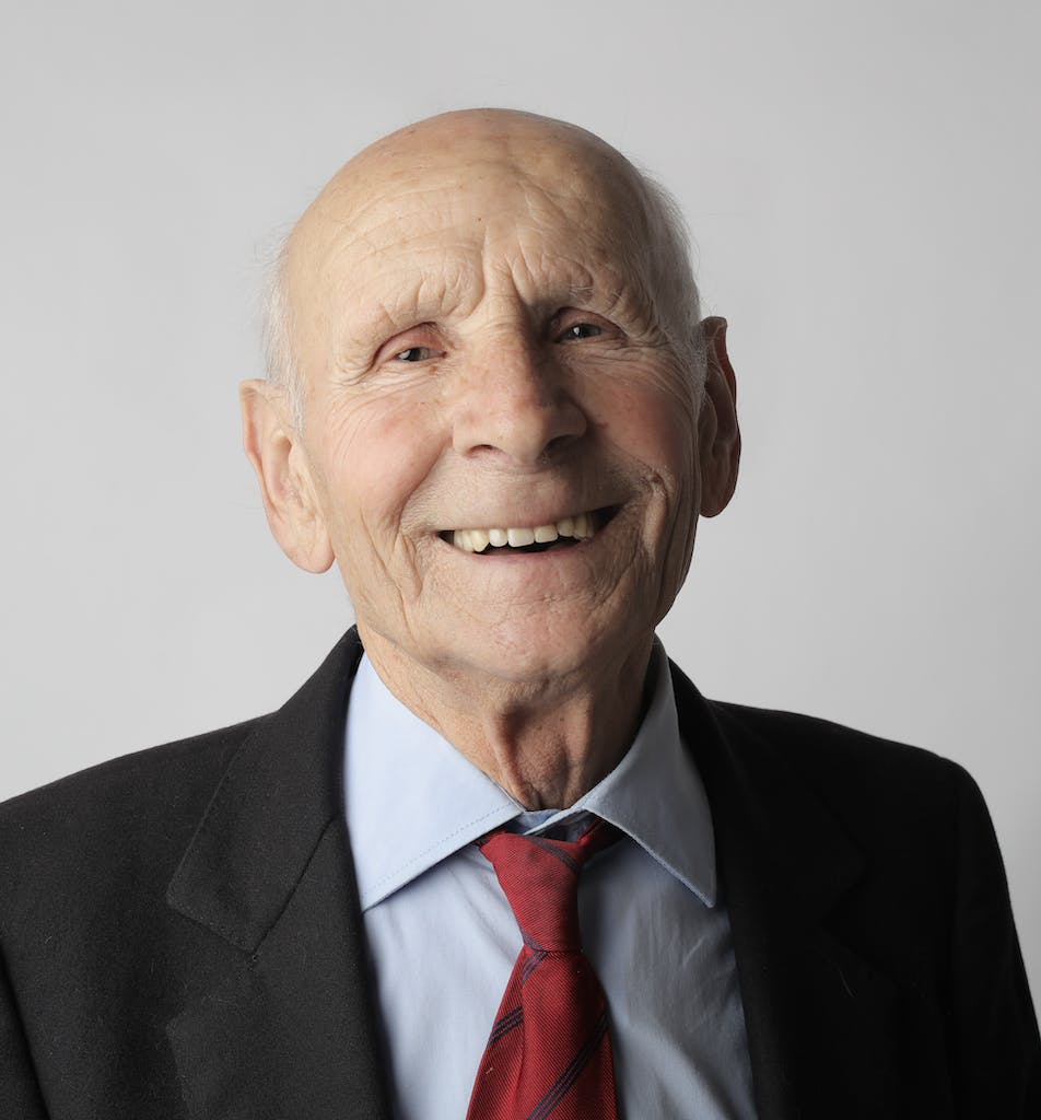 Man in Black Suit Jacket Smiling