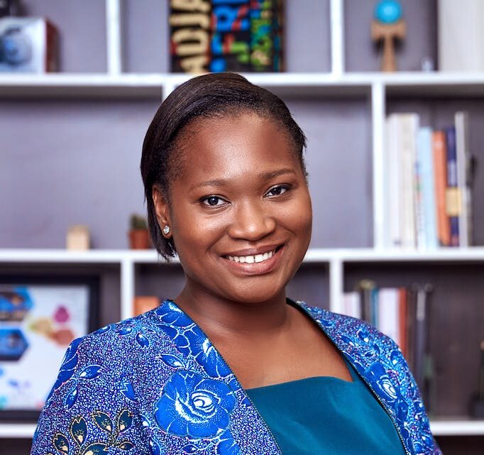 Woman In Blue Clothes Smiling
